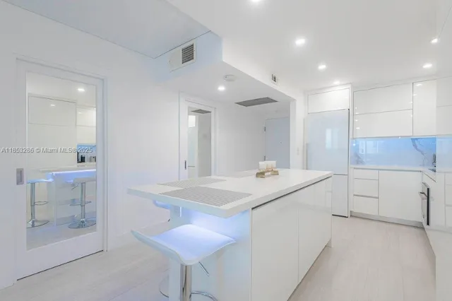 a kitchen with a sink a stove and cabinets