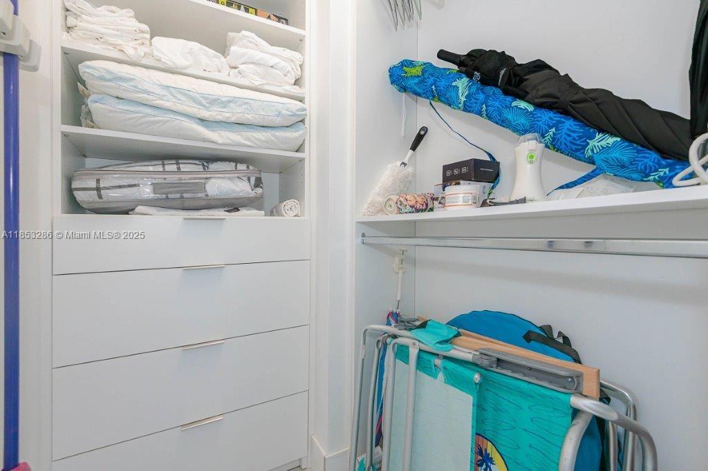 2301 Collins Avenue, Unit 811 Miami Beach, FL 33139 - Photo 24 of 42 a utility room with dryer and washer