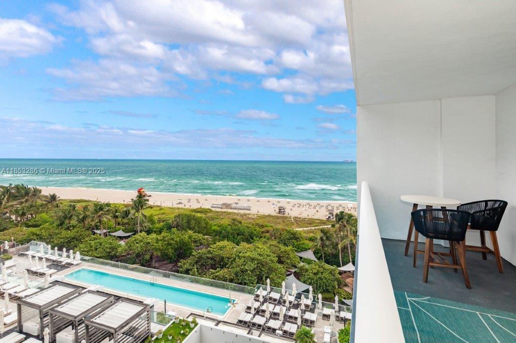 2301 Collins Avenue, Unit 811 Miami Beach, FL 33139 - Photo 25 of 42 a view of a chairs and table in patio