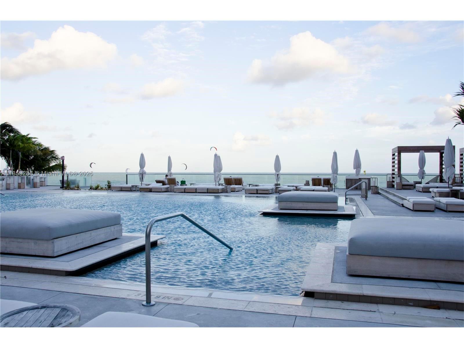2301 Collins Avenue, Unit 811 Miami Beach, FL 33139 - Photo 40 of 42 a view of the terrace with couches and sky view