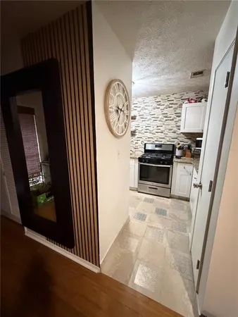 a view of a hallway with washer and dryer