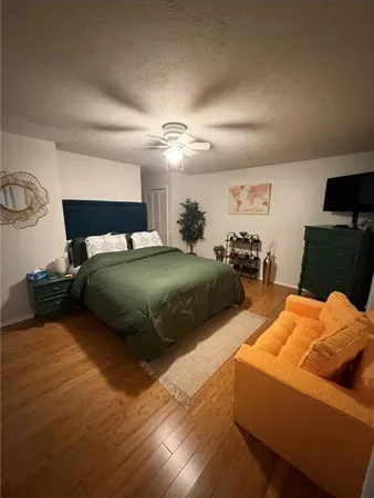 a bedroom with furniture and a fireplace