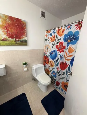 a bathroom with a toilet and a sink