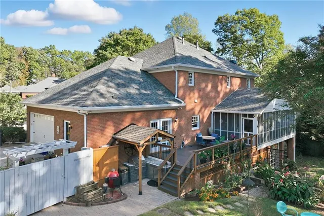 a bedroom with a bed and a chair