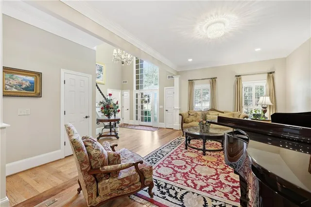 a bathroom with a granite countertop sink mirror vanity and toilet