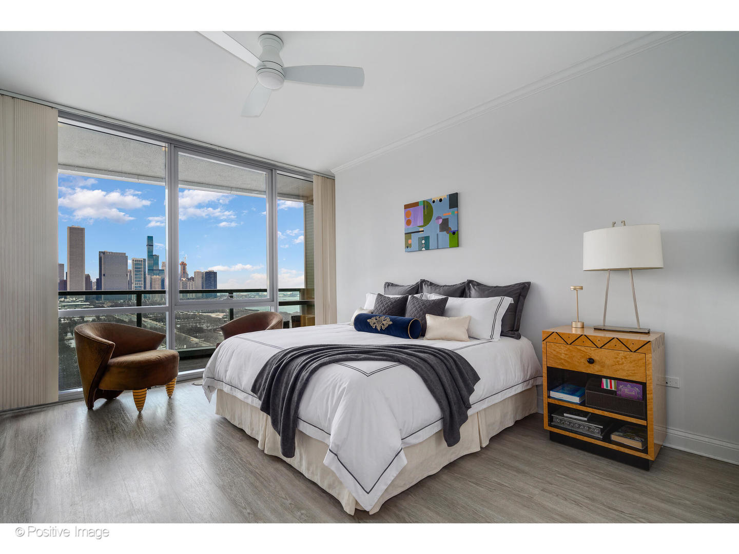 1201 South Prairie Avenue, Unit 2402 Chicago, IL 60605 - Photo 14 of 32 a bedroom with a bed and a large window