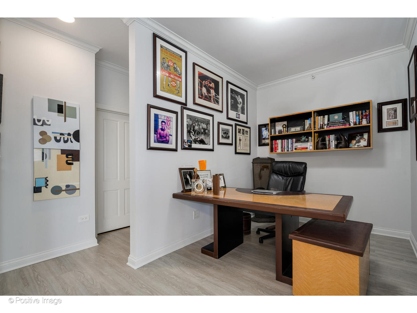 1201 South Prairie Avenue, Unit 2402 Chicago, IL 60605 - Photo 19 of 32 a room with furniture and paintings on the wall