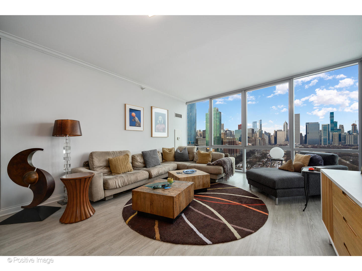 1201 South Prairie Avenue, Unit 2402 Chicago, IL 60605 - Photo 5 of 32 a living room with furniture and a large window