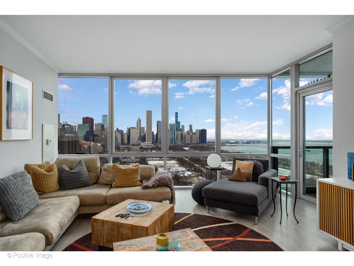 1201 South Prairie Avenue, Unit 2402 Chicago, IL 60605 - Photo 6 of 32 a living room with furniture and a floor to ceiling window