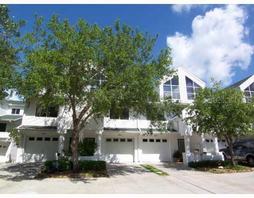 9930 Indian Key Trail Seminole, FL 33776 - Photo 1 of 1 a view of a building with a yard and sitting area