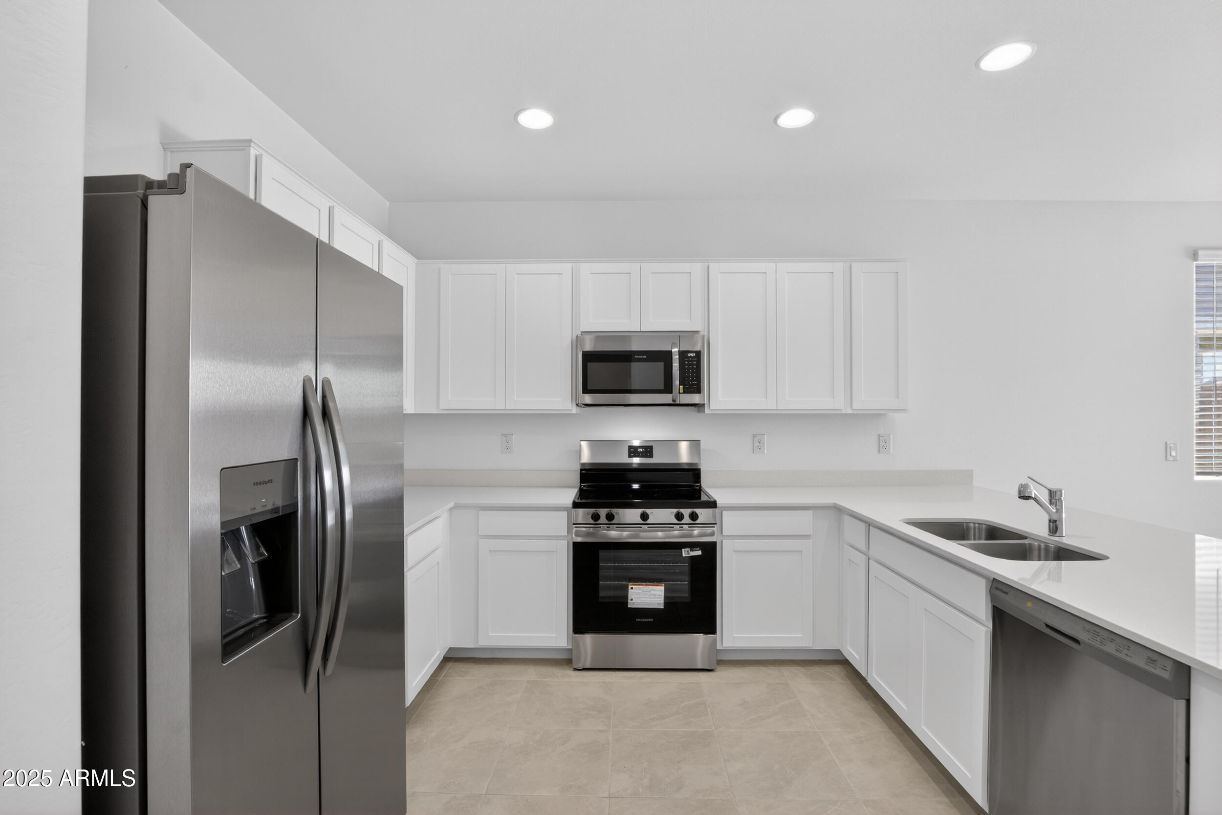12509 East Verbina Lane Florence, AZ 85132 - Photo 11 of 31 a kitchen with stainless steel appliances granite countertop a refrigerator a stove and a sink