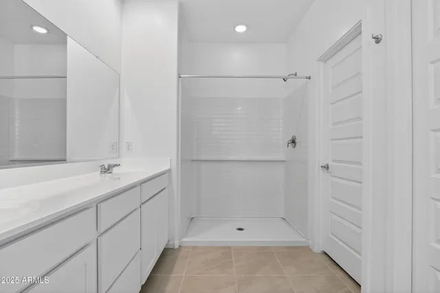 a bathroom with a shower and a tub
