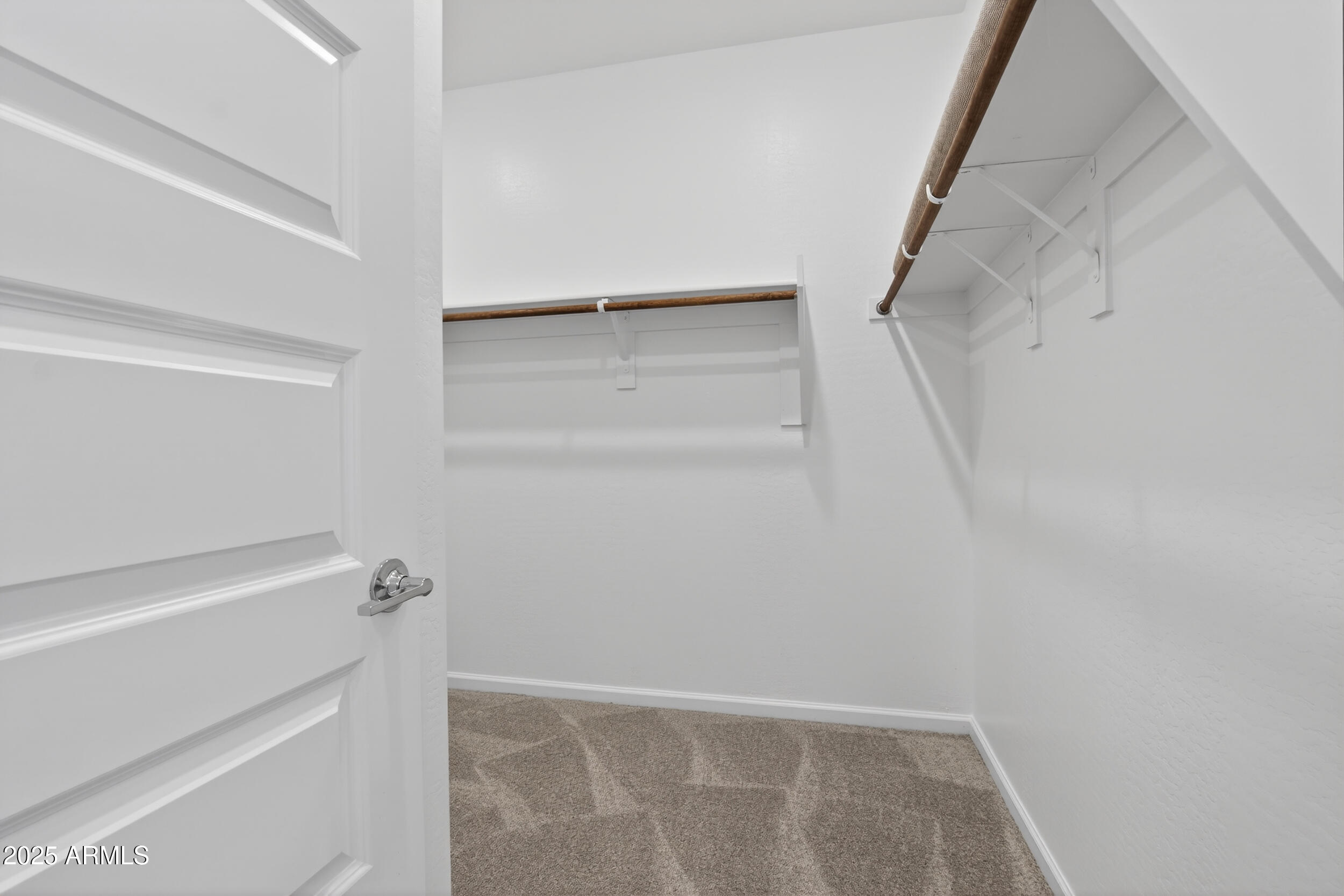 12509 East Verbina Lane Florence, AZ 85132 - Photo 20 of 31 a view of walk in closet with empty racks