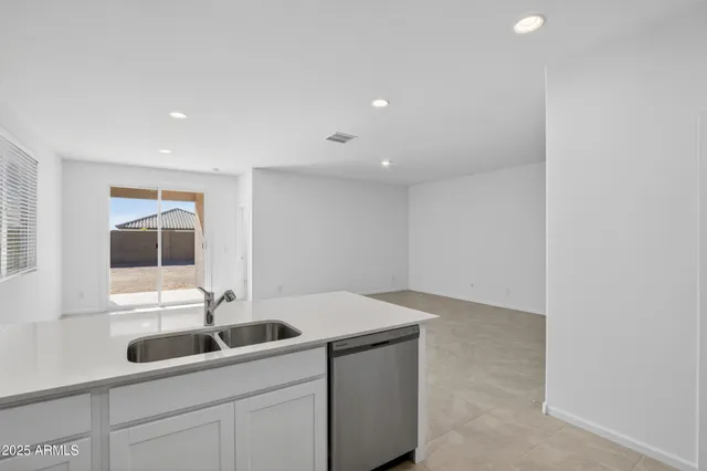 a kitchen with a sink and cabinets