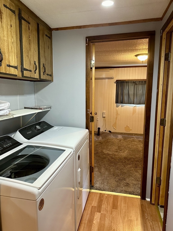 55 Heath Road Colrain, MA 01340 - Photo 20 of 32 a utility room with wooden floor washer and dryer