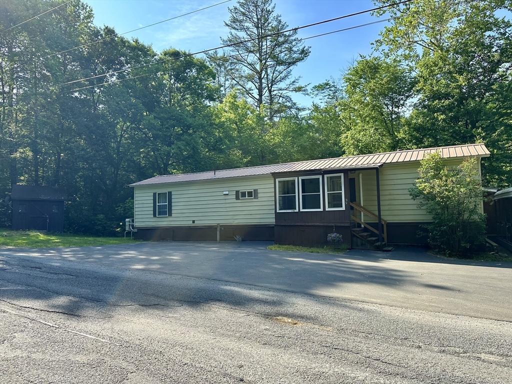 55 Heath Road Colrain, MA 01340 - Photo 2 of 32 a front view of a house with a yard