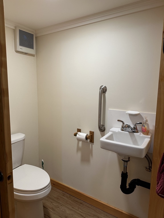 55 Heath Road Colrain, MA 01340 - Photo 31 of 32 a bathroom with a sink toilet and a mirror