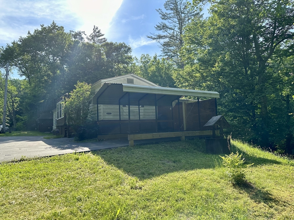 55 Heath Road Colrain, MA 01340 - Photo 7 of 32 a backyard of a house with lots of green space
