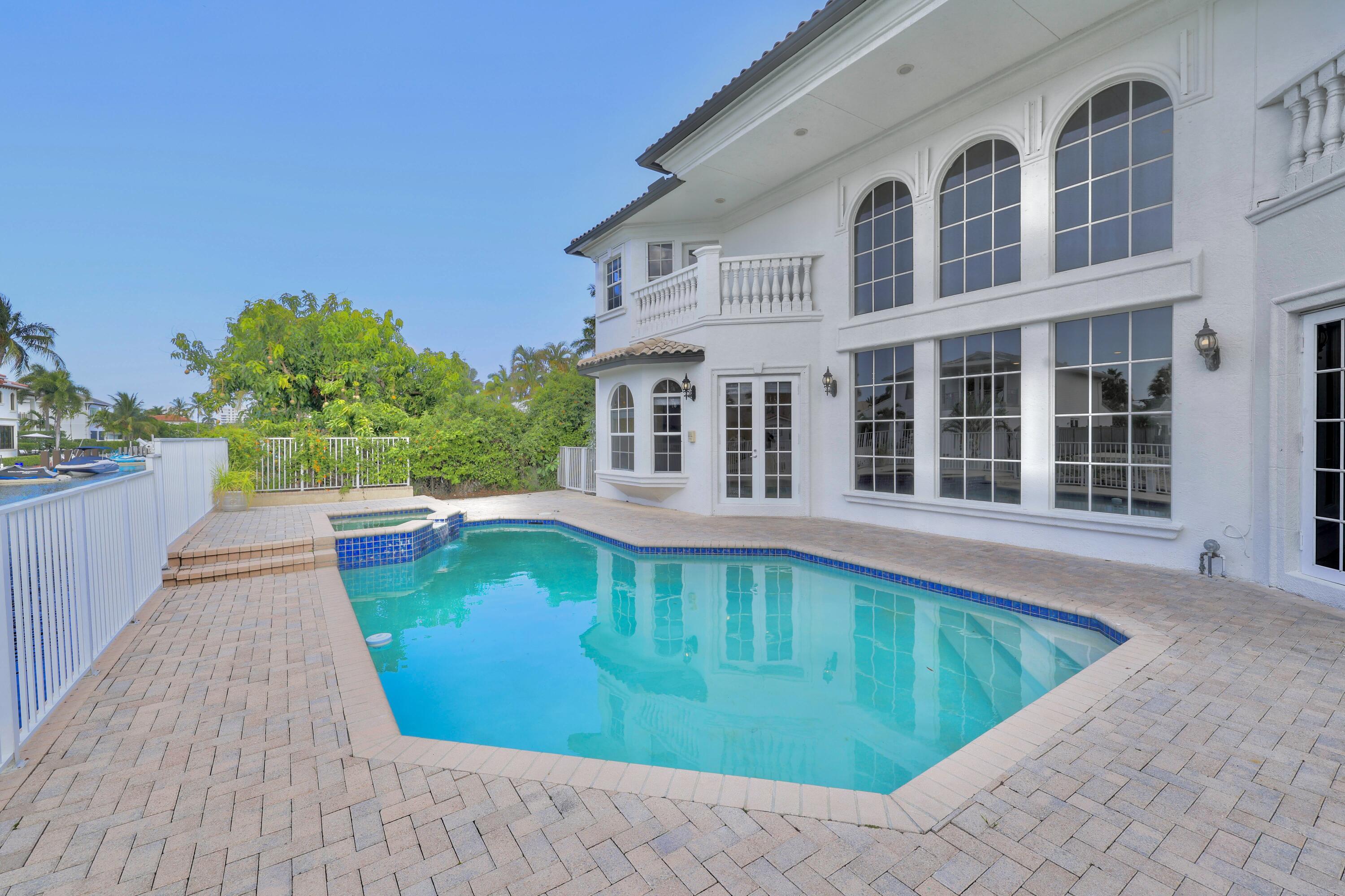 749 Northeast 71st Street Boca Raton, FL 33487 - Photo 40 of 43 a view of a house with a swimming pool