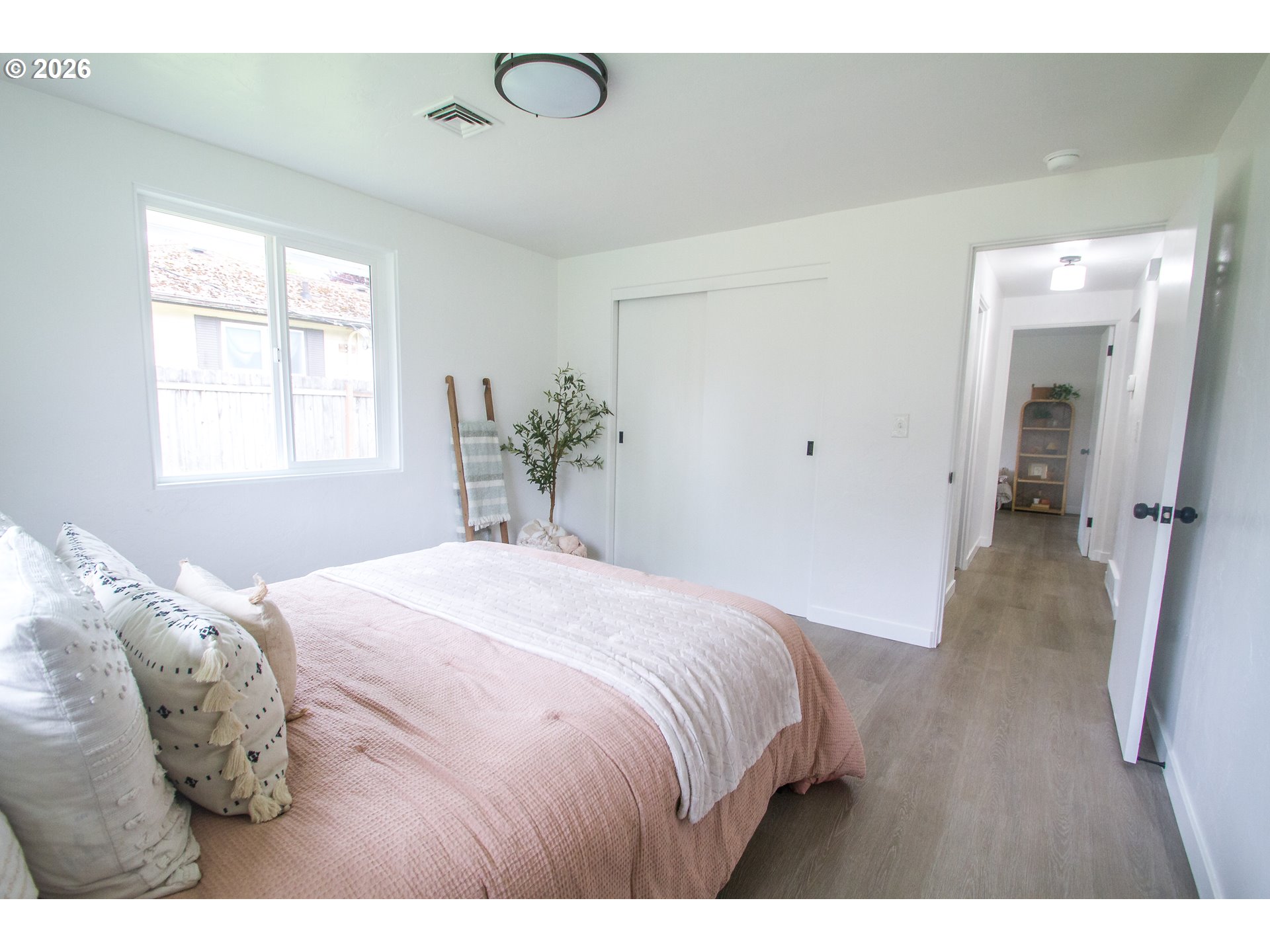 1490 Taft Street Eugene, OR 97402 - Photo 12 of 36 a bedroom with a bed and wooden floor
