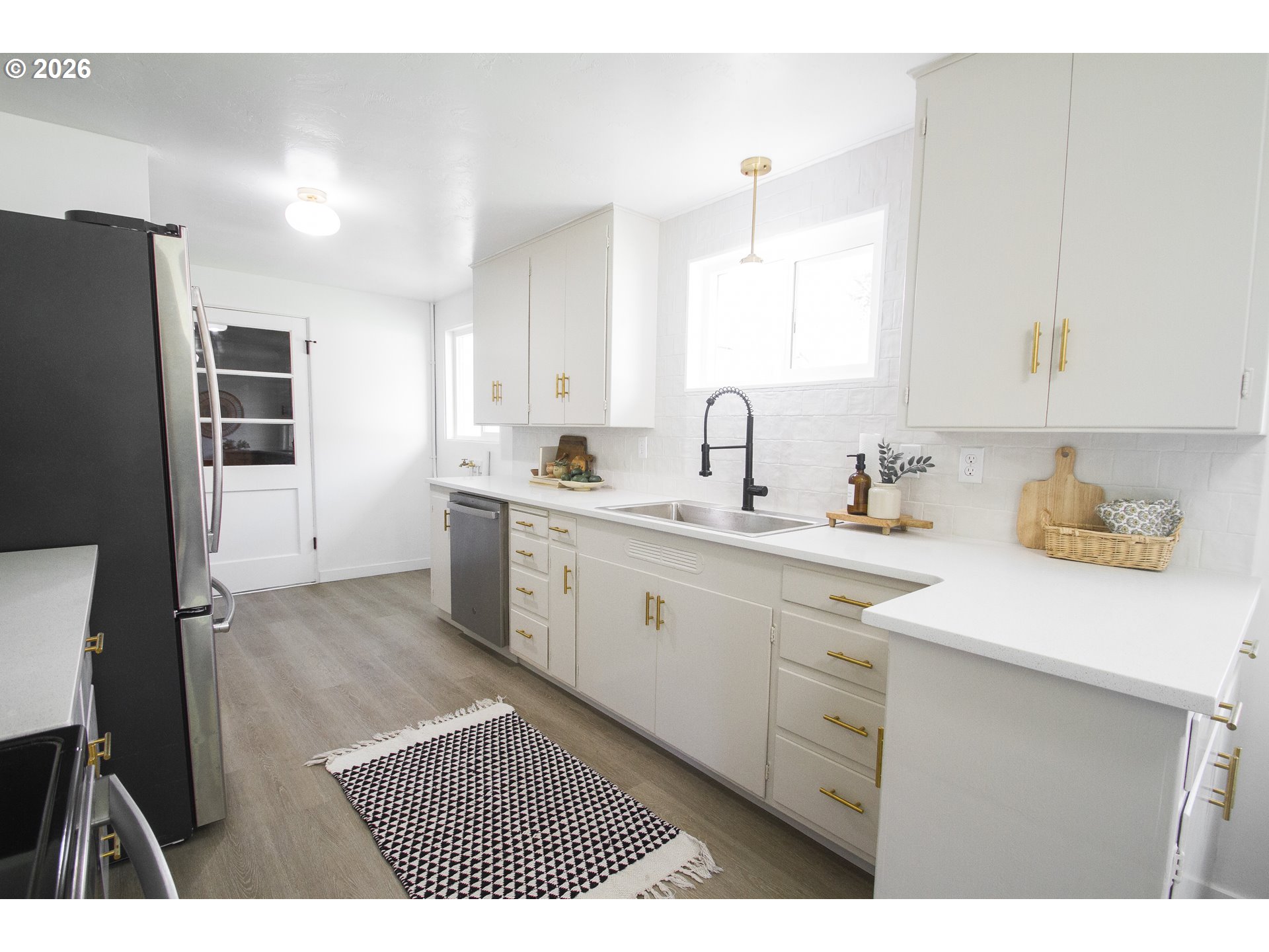 1490 Taft Street Eugene, OR 97402 - Photo 20 of 36 a kitchen with a sink appliances and cabinets