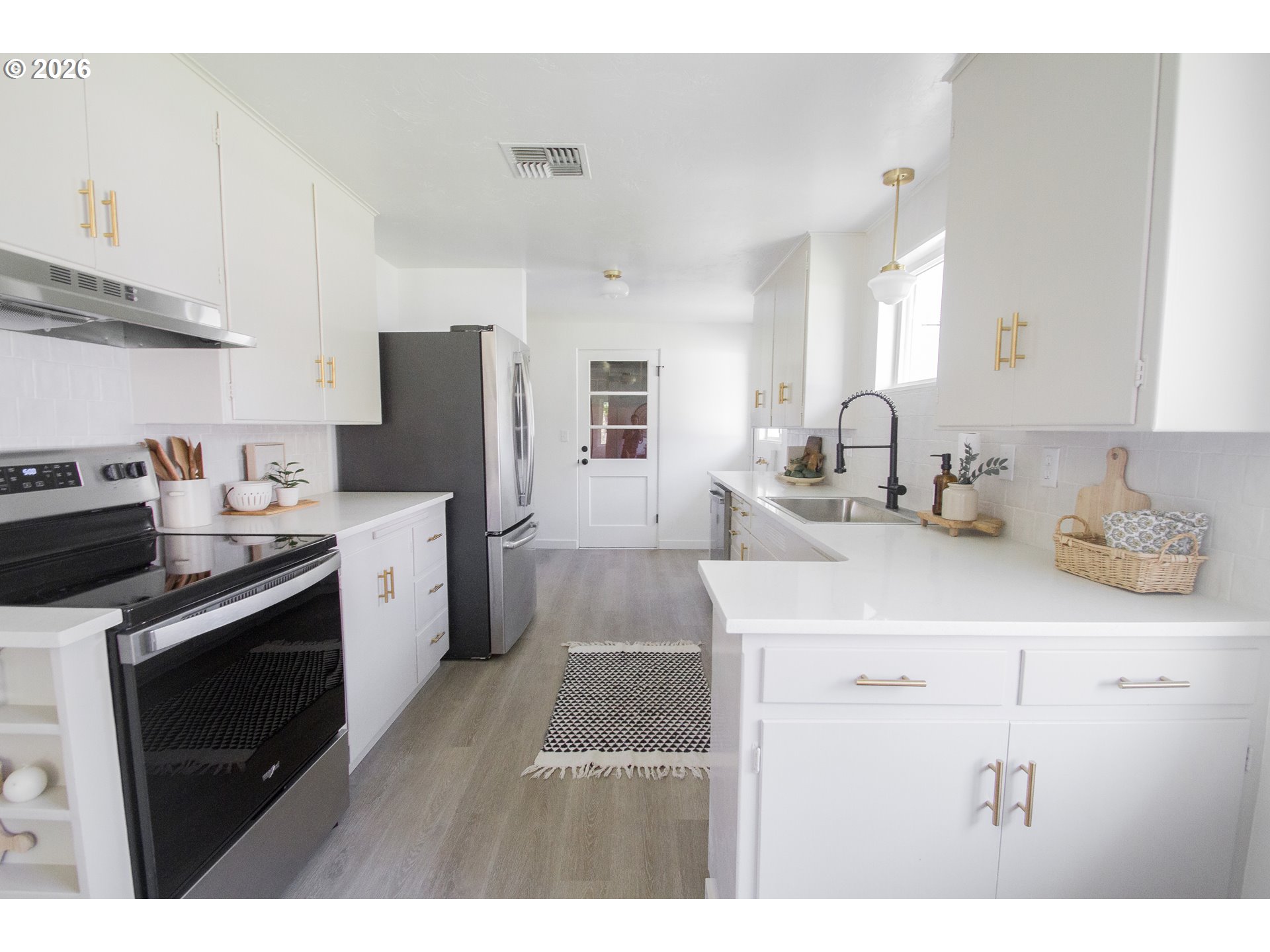 1490 Taft Street Eugene, OR 97402 - Photo 21 of 36 a kitchen with a sink appliances and cabinets