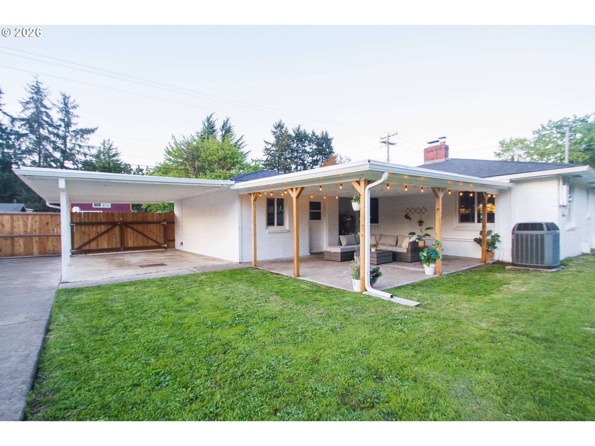 1490 Taft Street Eugene, OR 97402 - Photo 27 of 36 a view of a house with backyard porch and sitting area