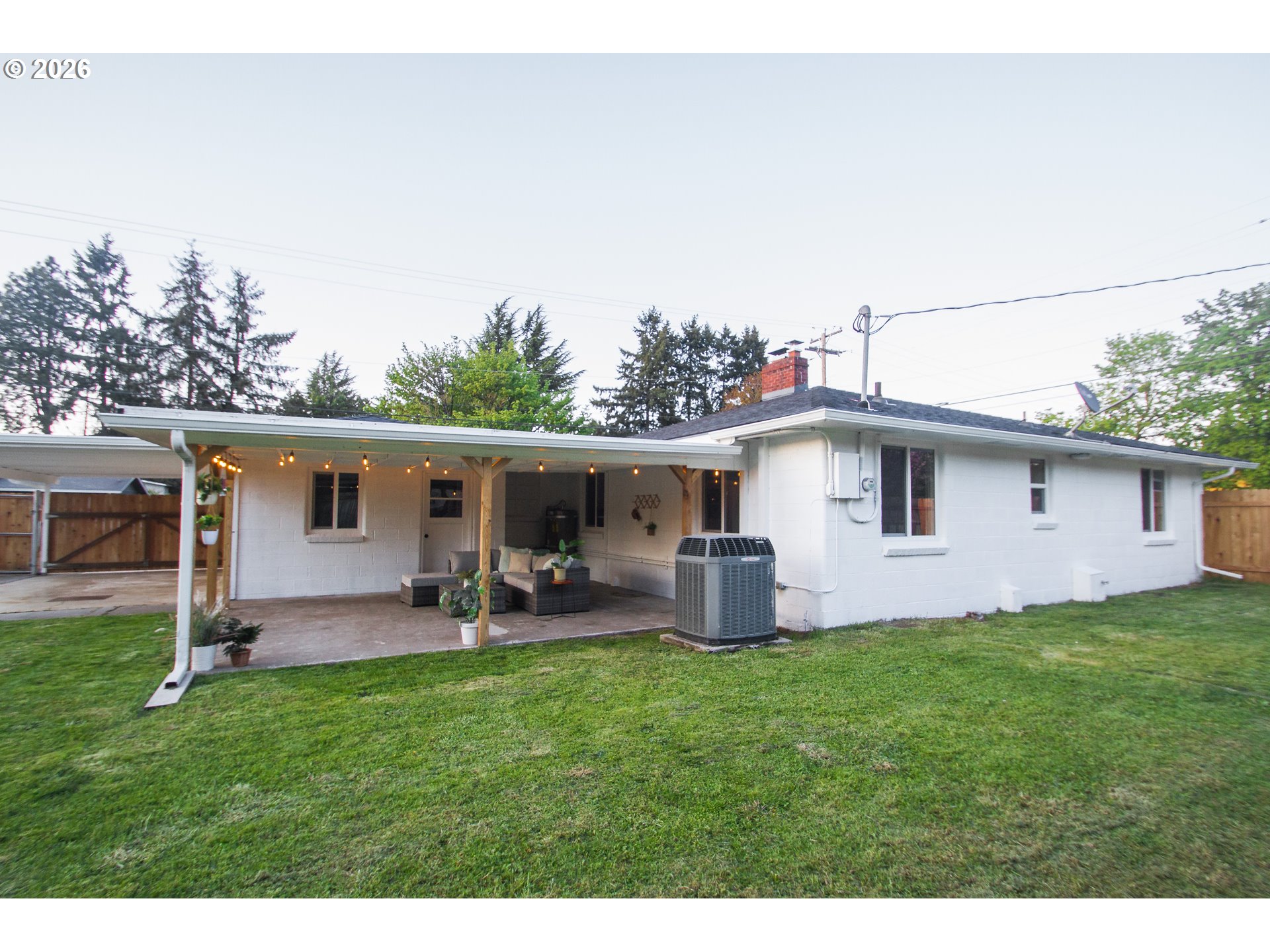 1490 Taft Street Eugene, OR 97402 - Photo 29 of 36 a view of a backyard with table and chairs and wooden fence
