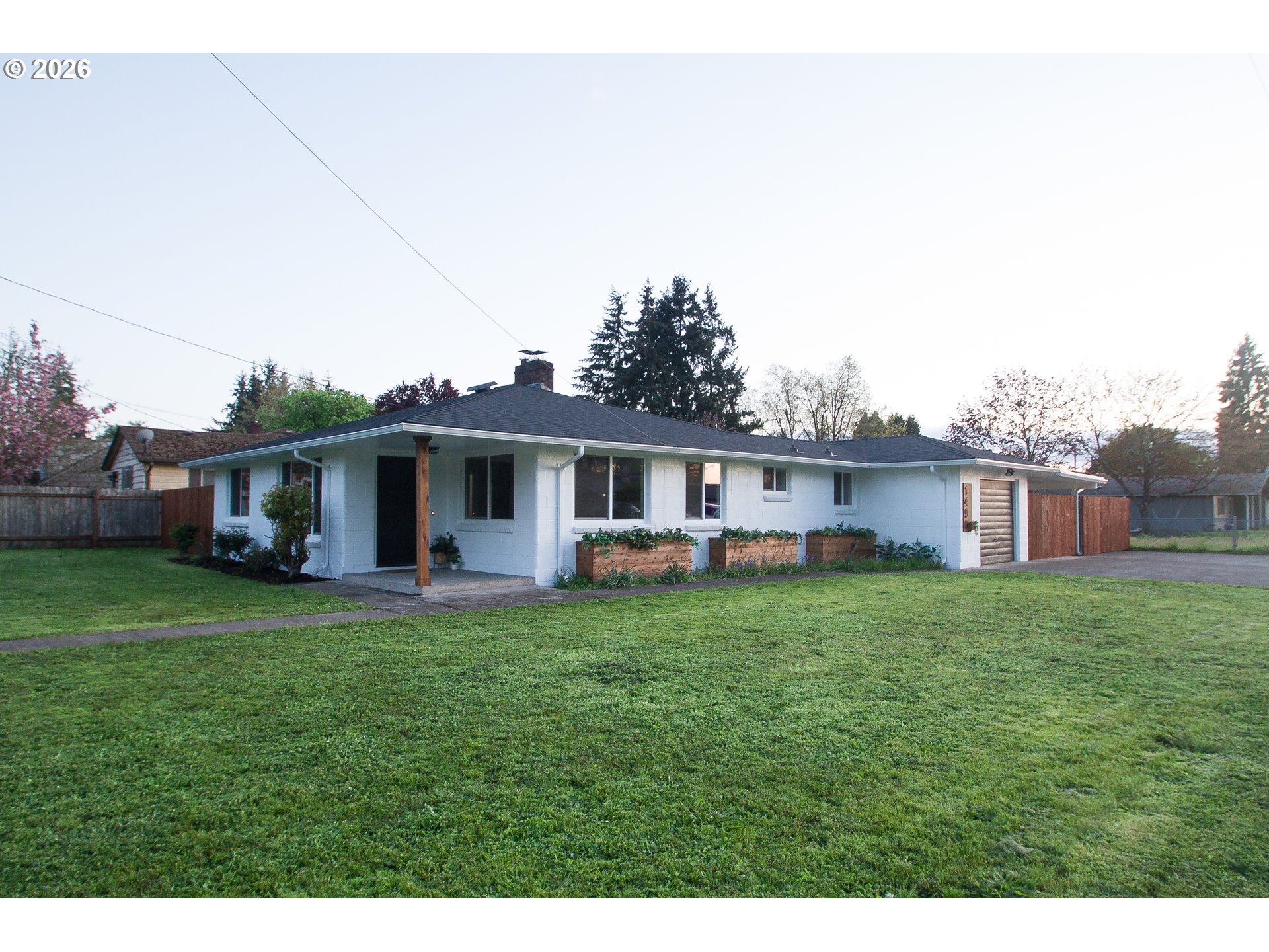 1490 Taft Street Eugene, OR 97402 - Photo 3 of 36 a view of a yard in front of a house