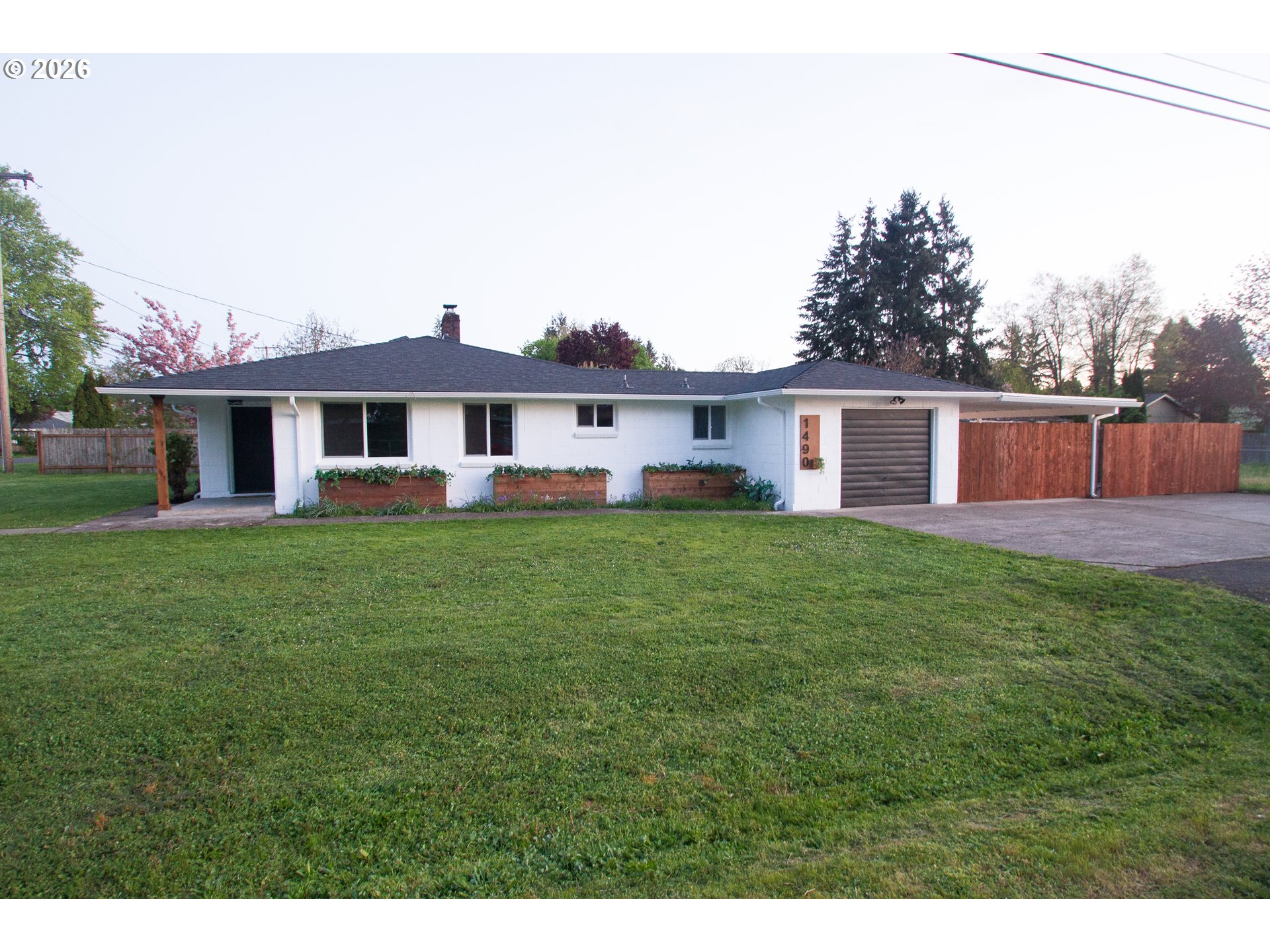 1490 Taft Street Eugene, OR 97402 - Photo 4 of 36 a front view of a house with a garden