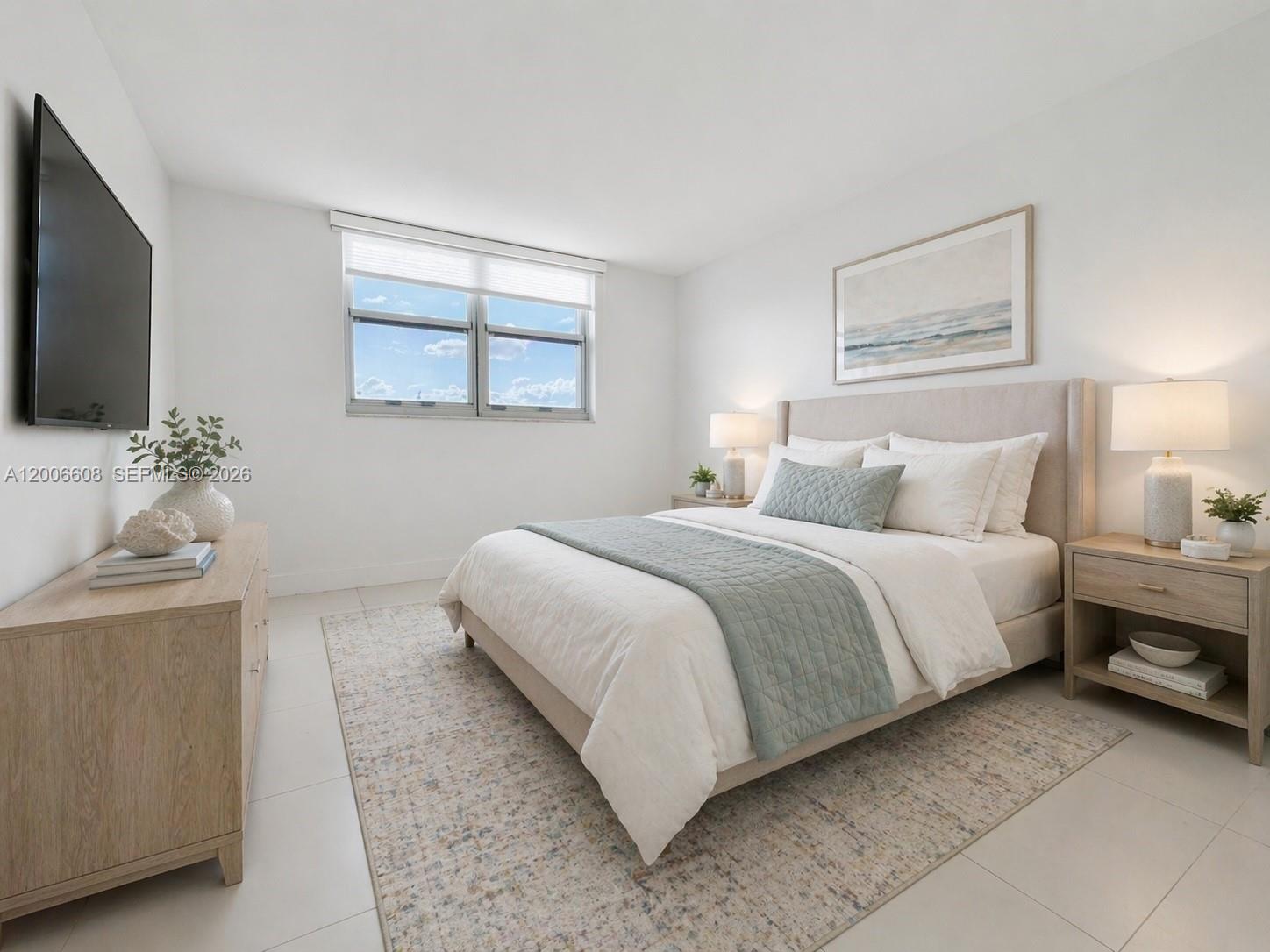 210 Seaview Drive, Unit 403 Key Biscayne, FL 33149 - Photo 13 of 31 a bedroom with a bed and a flat screen tv