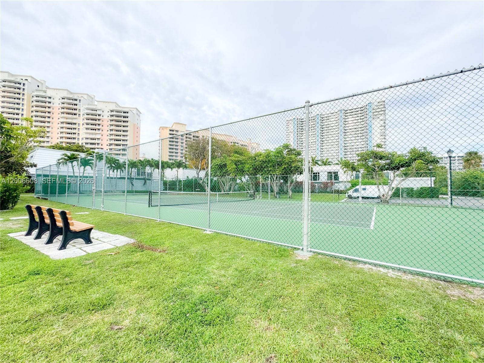 210 Seaview Drive, Unit 403 Key Biscayne, FL 33149 - Photo 29 of 31 a view of a garden with tall buildings