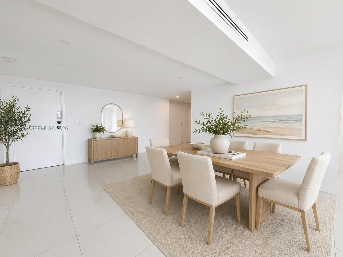 210 Seaview Drive, Unit 403 Key Biscayne, FL 33149 - Photo 3 of 31 a view of a dining room with furniture and potted plant