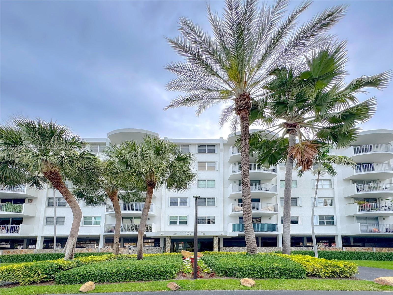 210 Seaview Drive, Unit 403 Key Biscayne, FL 33149 - Photo 31 of 31 a view of residential houses with yard and green space
