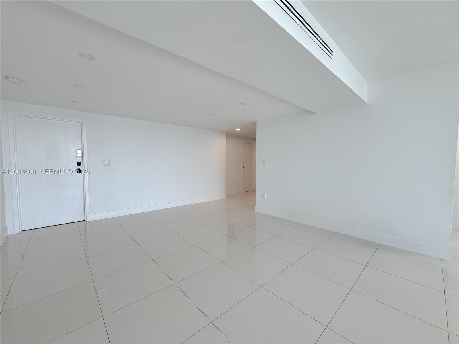 210 Seaview Drive, Unit 403 Key Biscayne, FL 33149 - Photo 4 of 31 a view of an empty room with a window