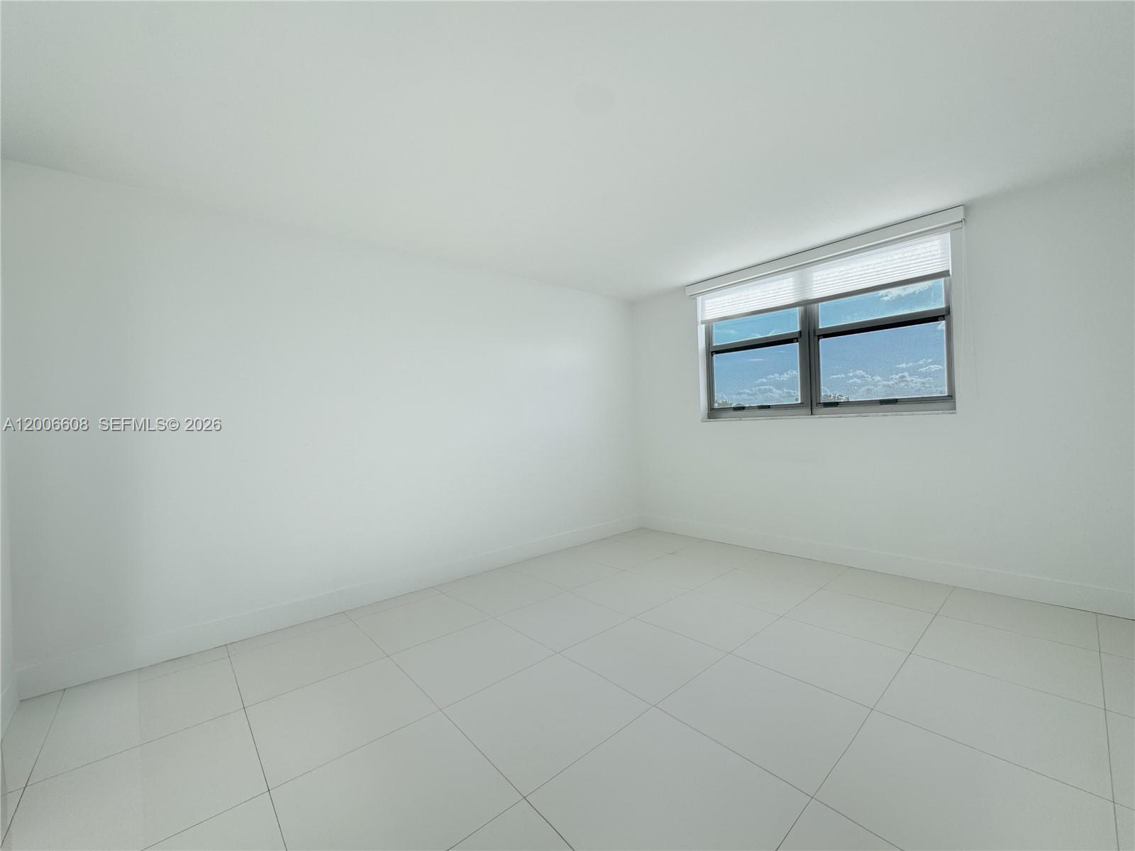210 Seaview Drive, Unit 403 Key Biscayne, FL 33149 - Photo 8 of 31 wooden floor in a empty room