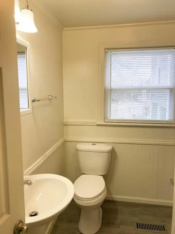 a bathroom with a toilet and a sink