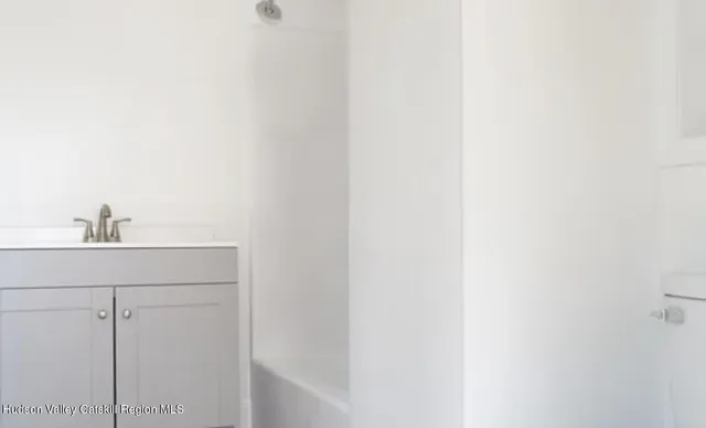 a bathroom with a sink and vanity