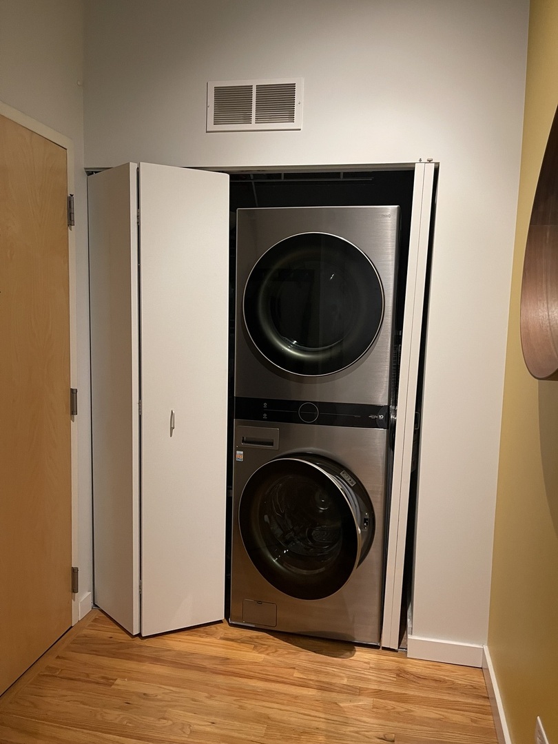 1720 South Michigan Avenue, Unit 2708 Chicago, IL 60616 - Photo 15 of 18 a view of a hallway with washer and dryer