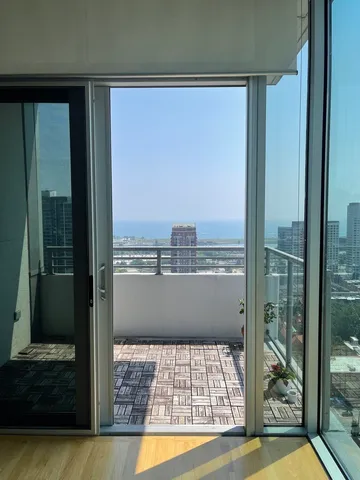 a view of a balcony with a floor to ceiling window