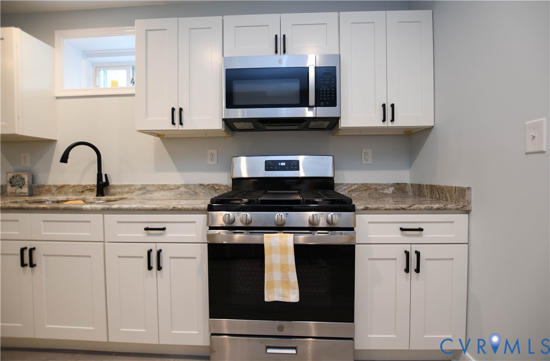 1448 Canterbury Road St. Stephens Church, VA 23148 - Photo 32 of 57 Kitchenette featuring white shaker-style cabinetry