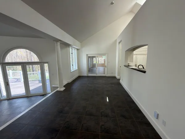 a view of a kitchen with a sink and a refrigerator
