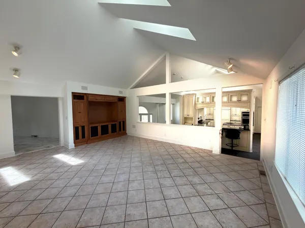 a view of a wooden deck and a yard