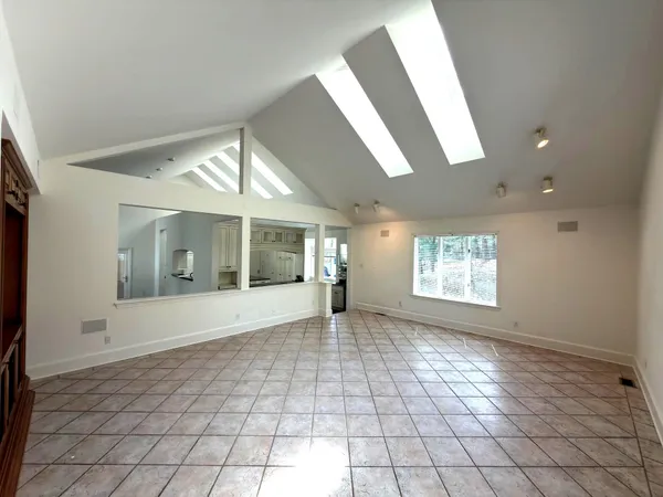 a view of a balcony with wooden floor