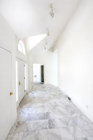 a front view of a house with parking space