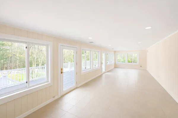 front view of a house with a large trees