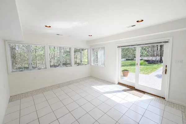a view of a city with lush green forest