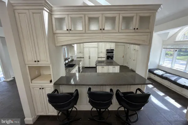 a view of an empty room with a fireplace and a window