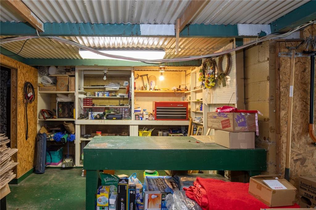 6 Scheffield Road Rosslyn Farms, PA 15106 - Photo 22 of 25 The work bench with shelving ...