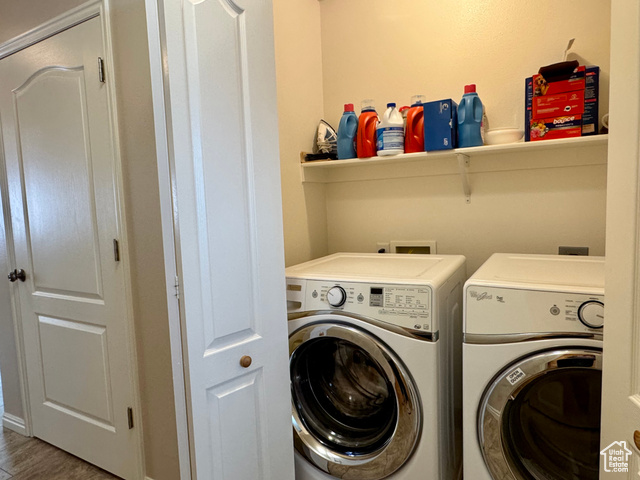 445 Topaz Boulevard, Unit 10 Delta, UT 84624 - Photo 17 of 28 Washroom featuring separate washer and dryer and wood finished floors